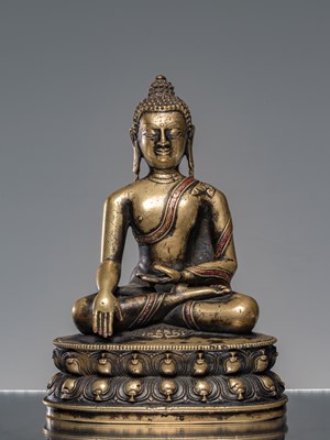 Lot 9 - A LARGE SILVER AND COPPER  INLAID BRONZE FIGURE OF SHAKYAMUNI BUDDHA, TIBET, 15TH CENTURY