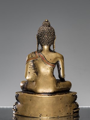 Lot 9 - A LARGE SILVER AND COPPER  INLAID BRONZE FIGURE OF SHAKYAMUNI BUDDHA, TIBET, 15TH CENTURY