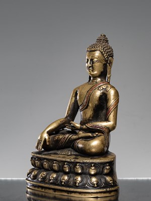 Lot 9 - A LARGE SILVER AND COPPER  INLAID BRONZE FIGURE OF SHAKYAMUNI BUDDHA, TIBET, 15TH CENTURY
