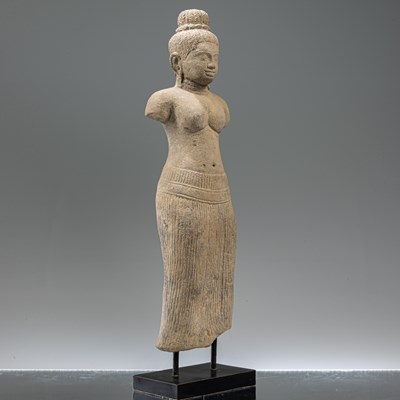 Lot 87 - STANDING SOUTH-EAST ASIAN SANDSTONE FIGURE OF UMA IN BAPHUOAN STYLE
