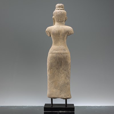 Lot 87 - STANDING SOUTH-EAST ASIAN SANDSTONE FIGURE OF UMA IN BAPHUOAN STYLE
