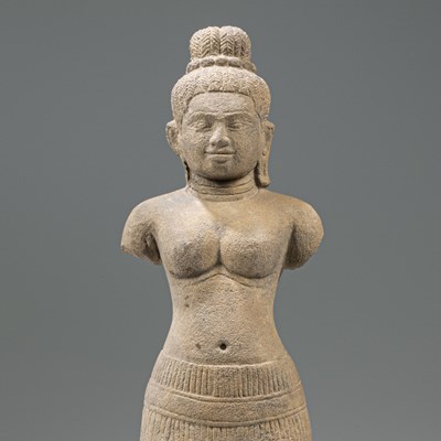 Lot 87 - STANDING SOUTH-EAST ASIAN SANDSTONE FIGURE OF UMA IN BAPHUOAN STYLE