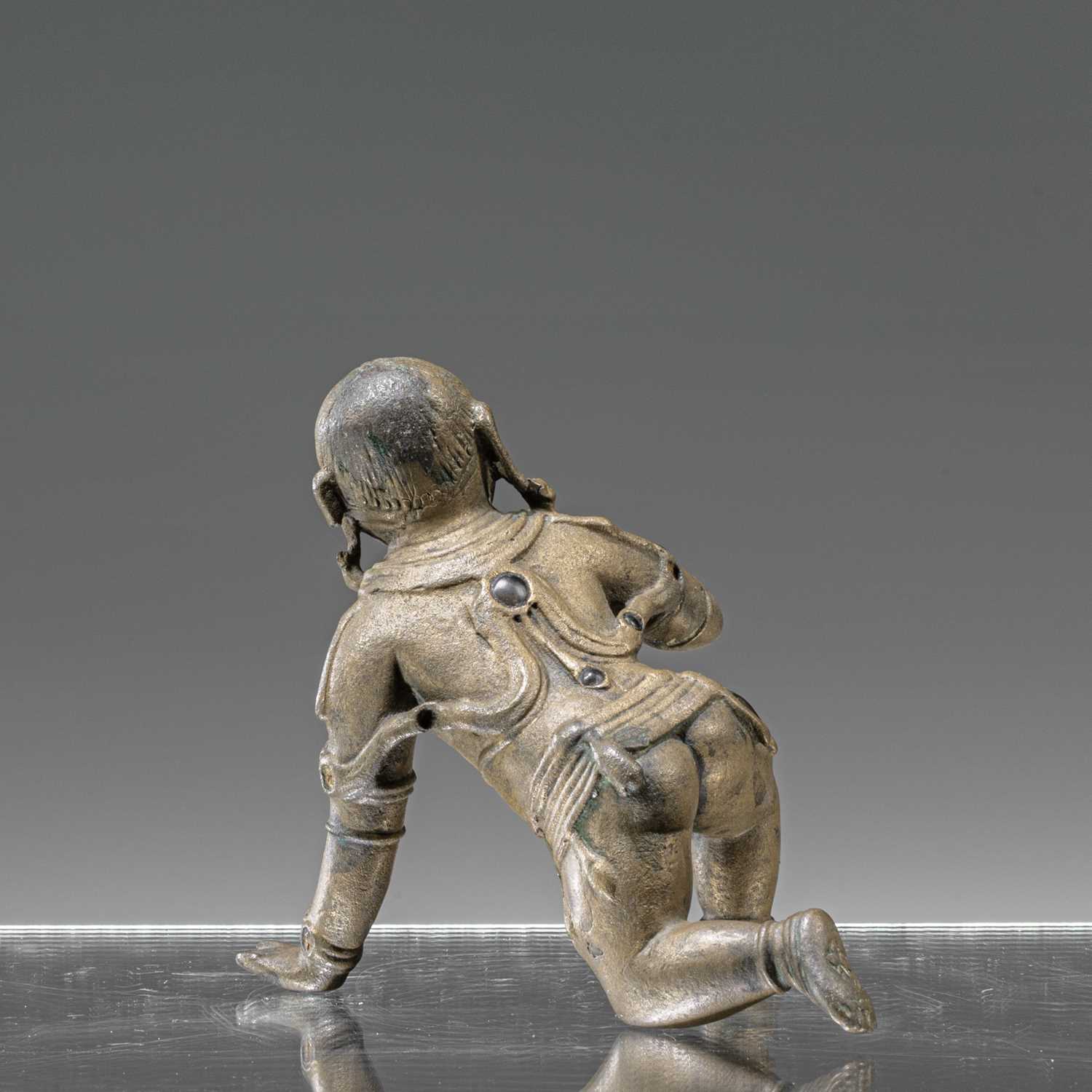 Lot 57 - BABY KRISHNA BRONZE WITH SILVER INLAYS INDIA 18TH CENTURY