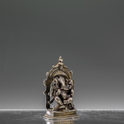 Lot 7 - INDIAN 16TH CENTURY SEATED SILVER GANESHA INSCRIBED AT THE BACK