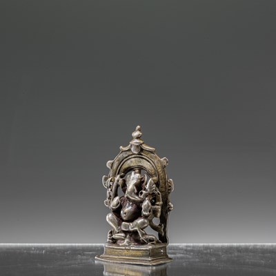 Lot 7 - INDIAN 16TH CENTURY SEATED SILVER GANESHA INSCRIBED AT THE BACK