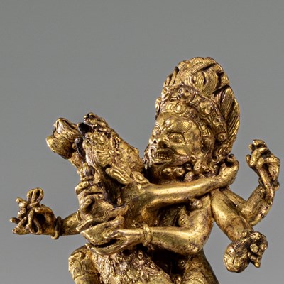 Lot 79 - GIL BRONZE NYINGSHUK MAHAKALA WITH SHAKTI NEPAL 18TH CENTURY
