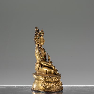 Lot 31 - MEDICINE BRONZE FIREGILT BUDDHA TIBET 16TH CENTURY
