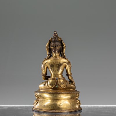 Lot 31 - MEDICINE BRONZE FIREGILT BUDDHA TIBET 16TH CENTURY