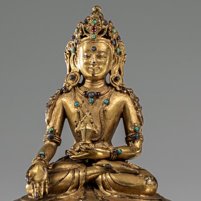 Lot 31 - MEDICINE BRONZE FIREGILT BUDDHA TIBET 16TH CENTURY