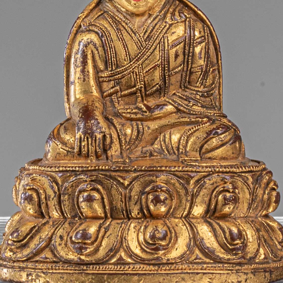 Lot 16 - SEATED BRONZE FIRGILT LAMA TIBET 18TH CENTURY