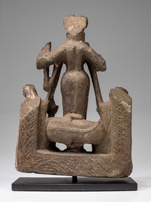 Lot 58 - LIME STONE SURYA WITH CONSORTS NEPAL 15TH CENTURY