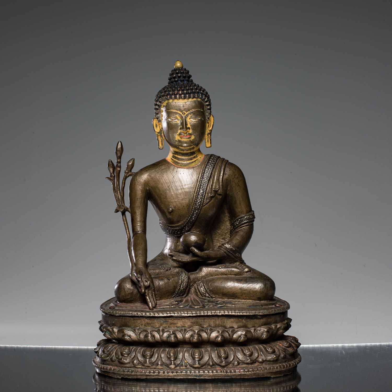 Lot 22 - SEATED MEDICINE BUDDHA BRONZE AND SILVER NEPAL 15TH CENTURY