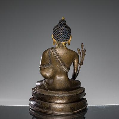 Lot 22 - SEATED MEDICINE BUDDHA BRONZE AND SILVER NEPAL 15TH CENTURY