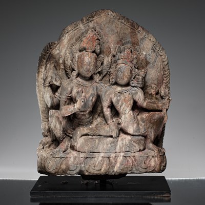 Lot 55 - SHIVA AND PARVATI AS UMA MAHESVARA STONE NEPAL 18TH CENTURY