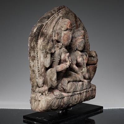 Lot 55 - SHIVA AND PARVATI AS UMA MAHESVARA STONE NEPAL 18TH CENTURY