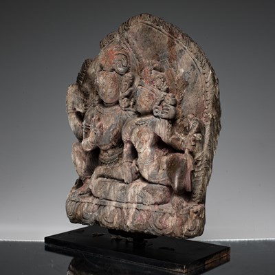 Lot 55 - SHIVA AND PARVATI AS UMA MAHESVARA STONE NEPAL 18TH CENTURY