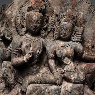 Lot 55 - SHIVA AND PARVATI AS UMA MAHESVARA STONE NEPAL 18TH CENTURY