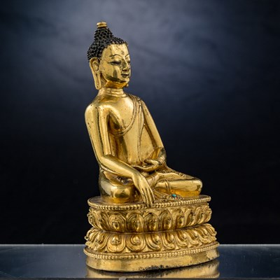 Lot 15 - SEATED BRONZE GILT AKSHOBYA BUDDHA TIBET 14TH CENTURY