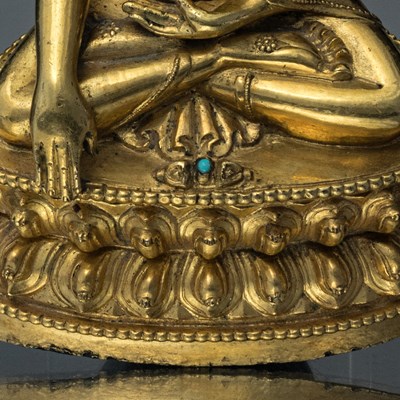 Lot 15 - SEATED BRONZE GILT AKSHOBYA BUDDHA TIBET 14TH CENTURY