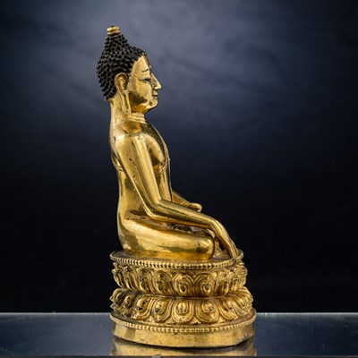 Lot 15 - SEATED BRONZE GILT AKSHOBYA BUDDHA TIBET 14TH CENTURY