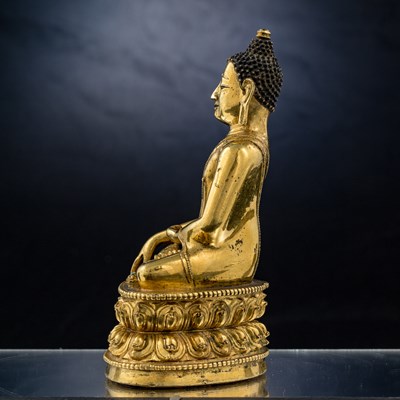 Lot 15 - SEATED BRONZE GILT AKSHOBYA BUDDHA TIBET 14TH CENTURY