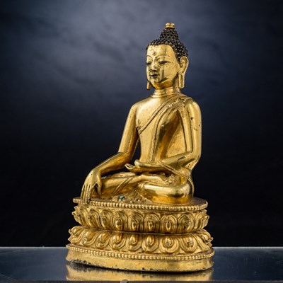 Lot 15 - SEATED BRONZE GILT AKSHOBYA BUDDHA TIBET 14TH CENTURY