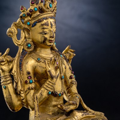 Lot 52 - SEATED BRONZE GILT PRAJNAPARAMITA TIBET 15TH CENTURY