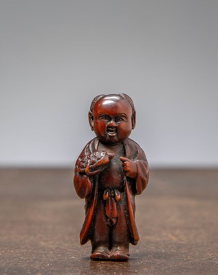 Lot 417 - (R) NETSUKE OF A BOY HOLDING A TORTOISE