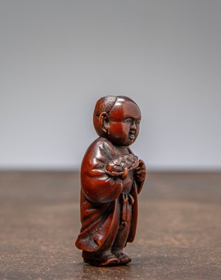 Lot 34 - (R) NETSUKE OF A BOY HOLDING A TORTOISE