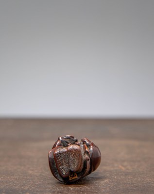 Lot 34 - (R) NETSUKE OF A BOY HOLDING A TORTOISE