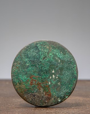 Lot 12 - (R)A CHINESE BRONZE MIRROR WITH KNOB , HAN DYNASTY (206 BCE - 220 CE)