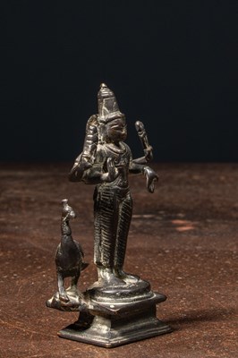Lot 72 - A BRONZE FIGURE OF KARTIKEYA (SKANDA) WITH HIS VEHICLE PEACOCK NEPAL 19TH CENTURY
