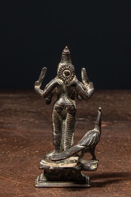 Lot 72 - A BRONZE FIGURE OF KARTIKEYA (SKANDA) WITH HIS VEHICLE PEACOCK NEPAL 19TH CENTURY