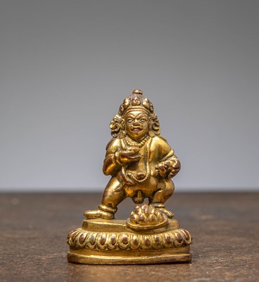 Lot 289 - A GILT-BRONZE FIGURE OF JAMBHALA, TIBET, 18TH CENTURY