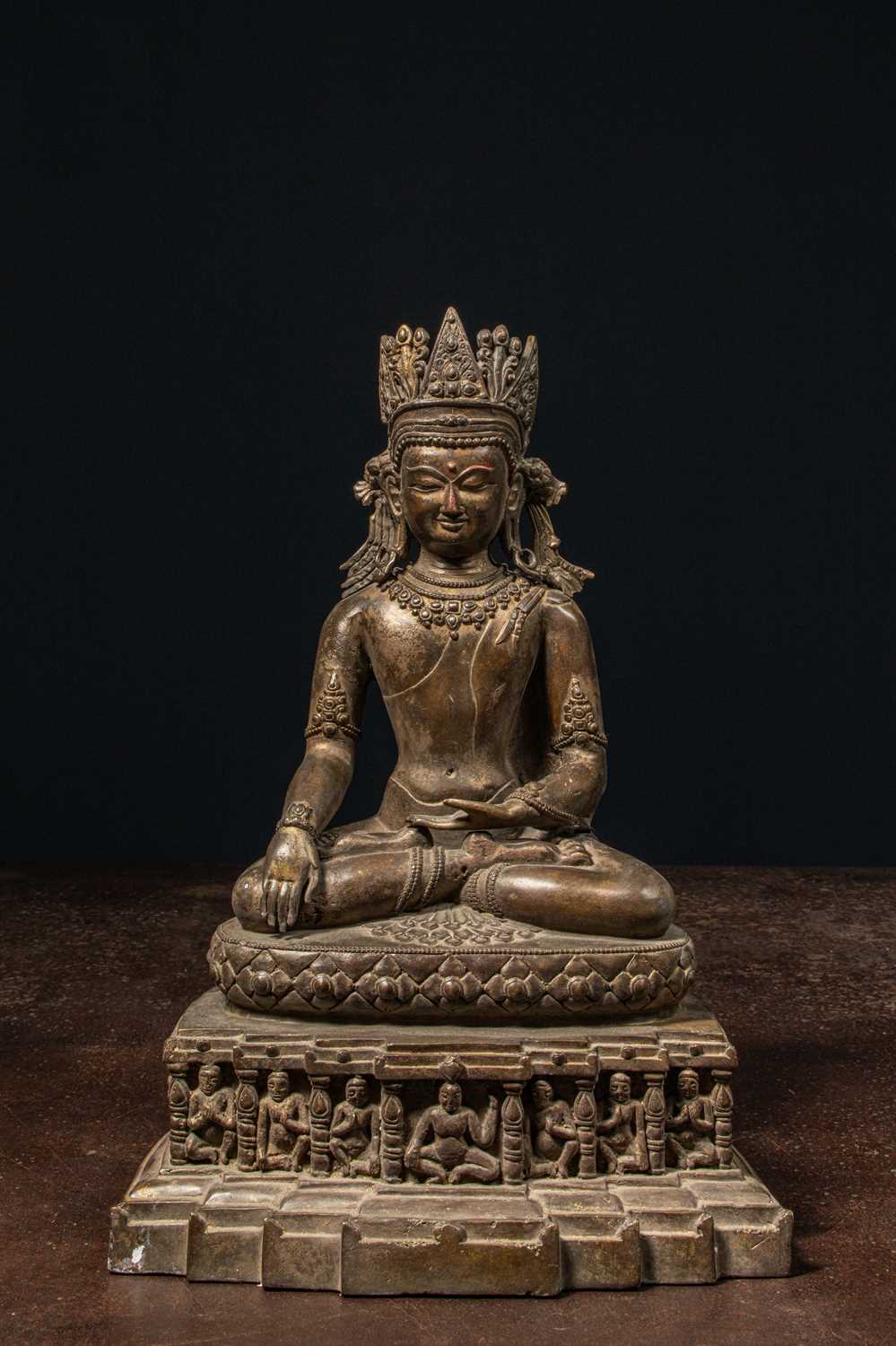 Lot 94 - A CROWNED BRONZE BUDDHA TIBET 13TH CENTURY STYLE BUT LATER