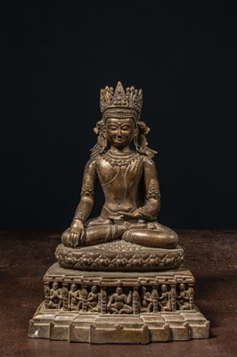 Lot 94 - A CROWNED BRONZE BUDDHA TIBET 13TH CENTURY STYLE BUT LATER