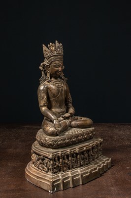 Lot 94 - A CROWNED BRONZE BUDDHA TIBET 13TH CENTURY STYLE BUT LATER