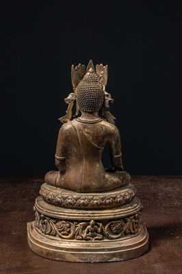 Lot 94 - A CROWNED BRONZE BUDDHA TIBET 13TH CENTURY STYLE BUT LATER