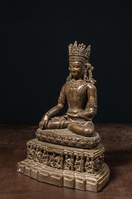 Lot 94 - A CROWNED BRONZE BUDDHA TIBET 13TH CENTURY STYLE BUT LATER