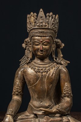 Lot 94 - A CROWNED BRONZE BUDDHA TIBET 13TH CENTURY STYLE BUT LATER