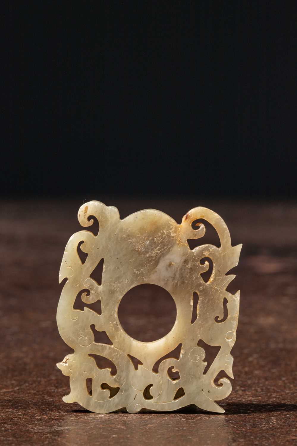 Lot 68 - A FINELY CARVED OPENWORK JADE PLAQUE CHINA LATE MING TO EARLY QING DYNASTY