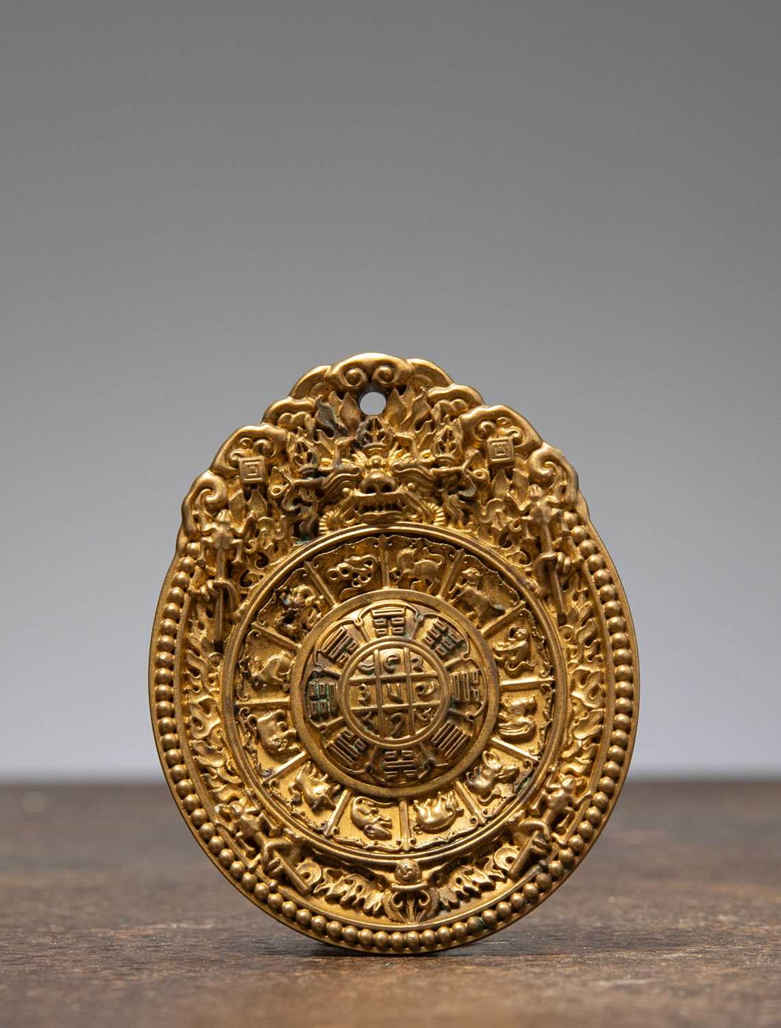Lot 13 - A GILT-BRONZE ZODIAC PLAQUE CHINA MING DYNASTY OR LATER