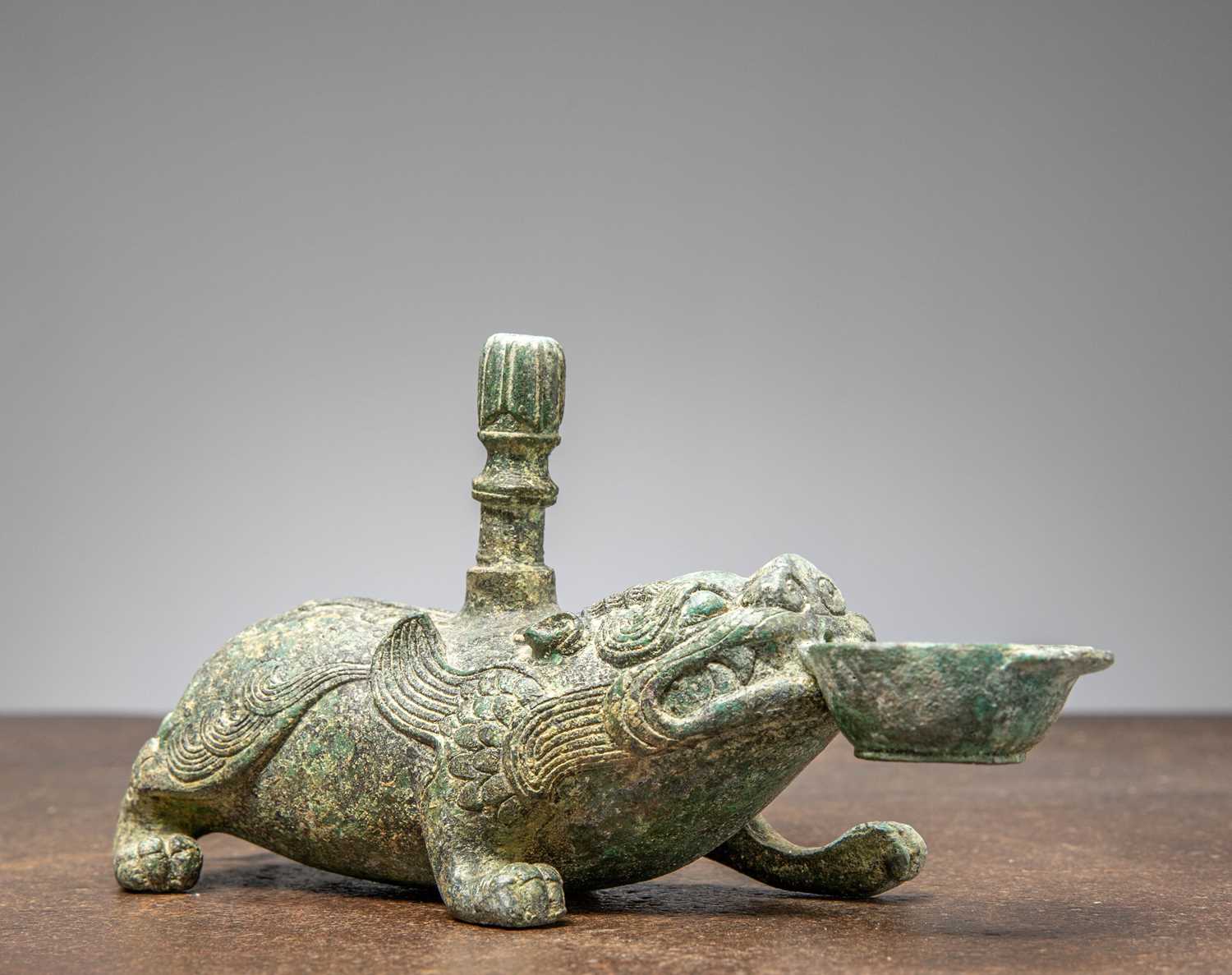 Lot 86 - A BRONZE FIGURE OF A MYTHICAL BEAST, CHINA, HAN DYNASTY OR LATER