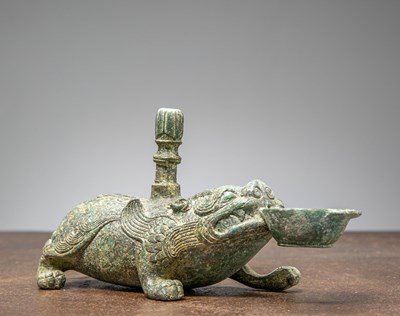 Lot 86 - A BRONZE FIGURE OF A MYTHICAL BEAST, CHINA, HAN DYNASTY OR LATER