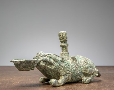 Lot 86 - A BRONZE FIGURE OF A MYTHICAL BEAST, CHINA, HAN DYNASTY OR LATER