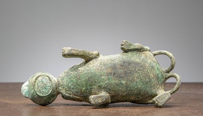 Lot 86 - A BRONZE FIGURE OF A MYTHICAL BEAST, CHINA, HAN DYNASTY OR LATER