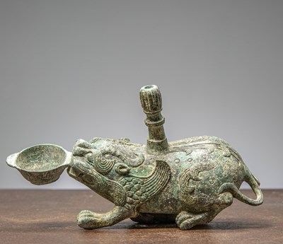 Lot 86 - A BRONZE FIGURE OF A MYTHICAL BEAST, CHINA, HAN DYNASTY OR LATER