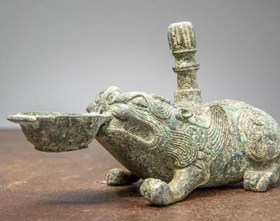 Lot 86 - A BRONZE FIGURE OF A MYTHICAL BEAST, CHINA, HAN DYNASTY OR LATER