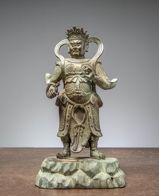 Lot 230 - A BRONZE FIGURE OF VIRIUPAKA, THE GUARDIAN KING OF THE WEST, CHINA, MING DYNASTY