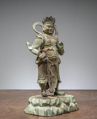 Lot 25 - A BRONZE FIGURE OF VIRŪPAKA, GUARDIAN KING OF THE WEST CHINA MING DYNASTY